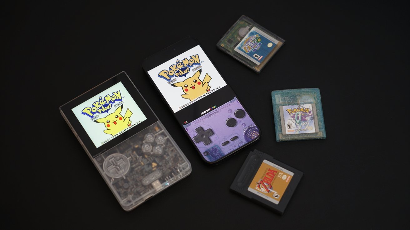 A Game Boy Color and various Pok&eacute;mon game cartridges on a black surface.