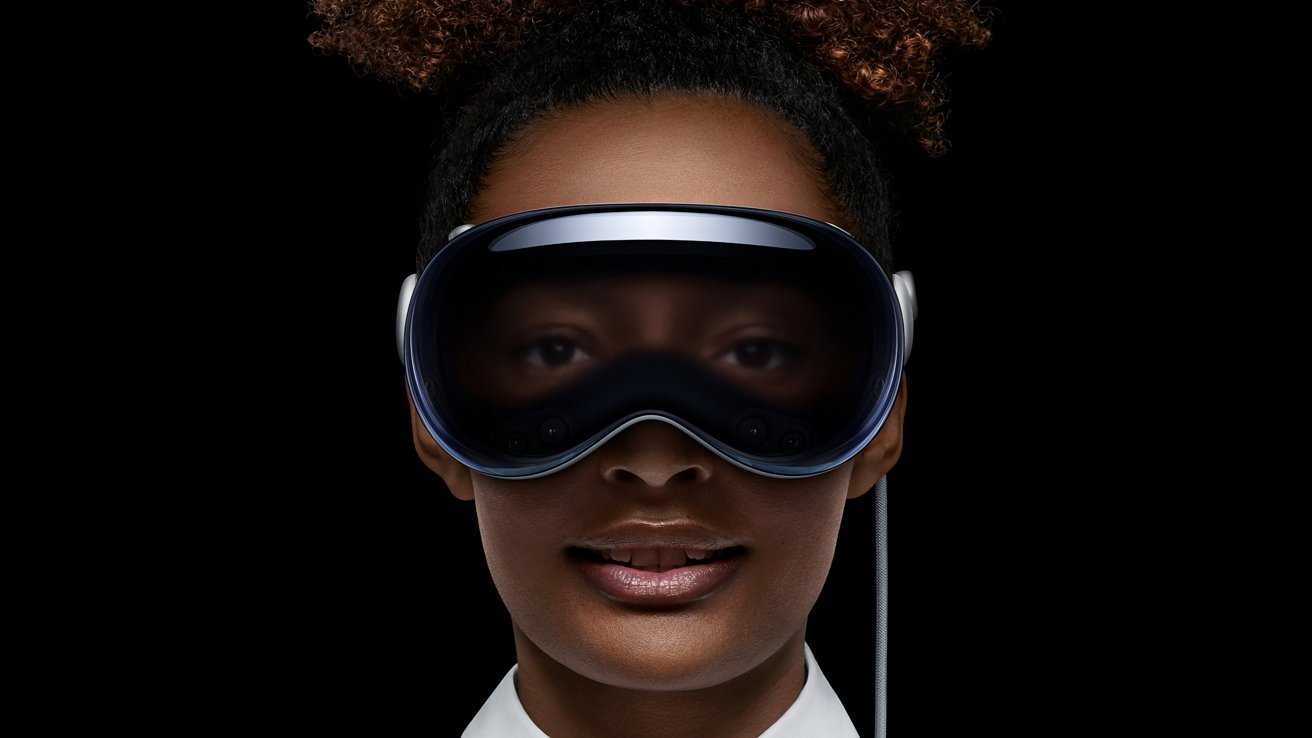 Person wearing a high-tech virtual reality headset, with their eyes visible through the device, set against a black background.