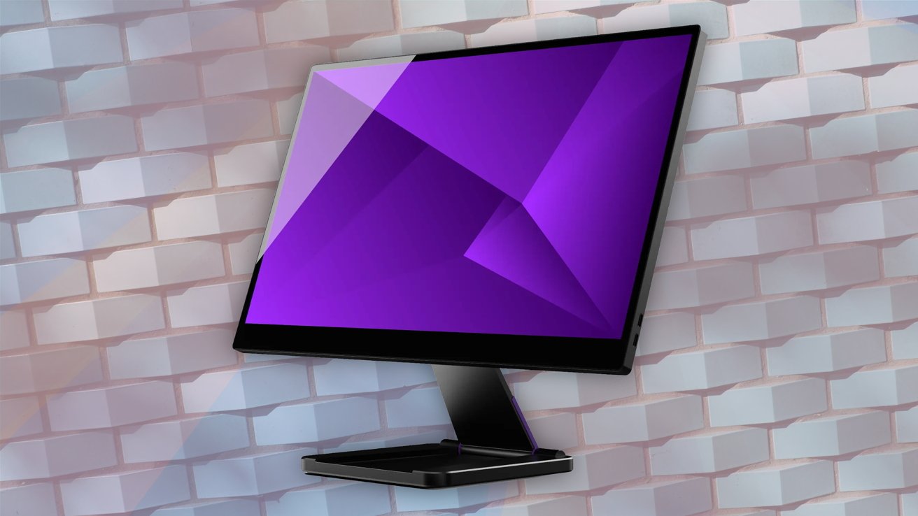 Computer monitor with a purple geometric pattern on the screen, set against a white 3D tiled brick wall.