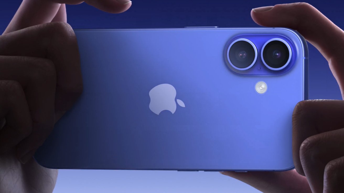 Hands holding a blue smartphone with dual camera lenses and flash, featuring an apple logo on the back.