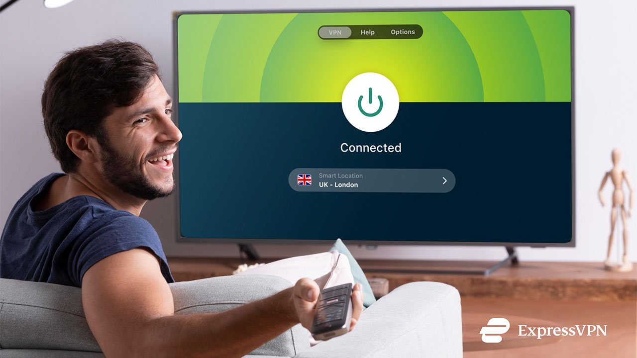 A smiling man on a couch holding a remote with a TV screen showing 'Connected' to ExpressVPN server in the UK.