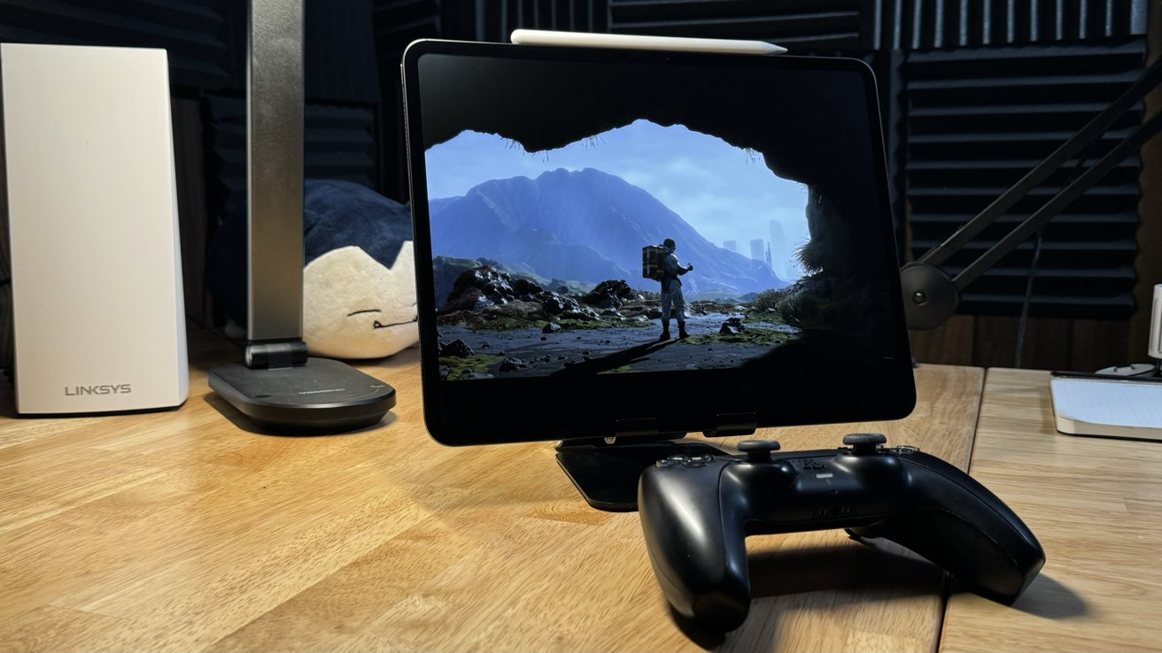 iPad Pro in a stand in front of a PlayStation 5 controller with a scene from 'Death Stranding' on the display