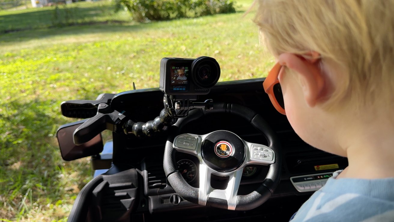 The GoPro Hero 13 Black attached to the dash of a kids car