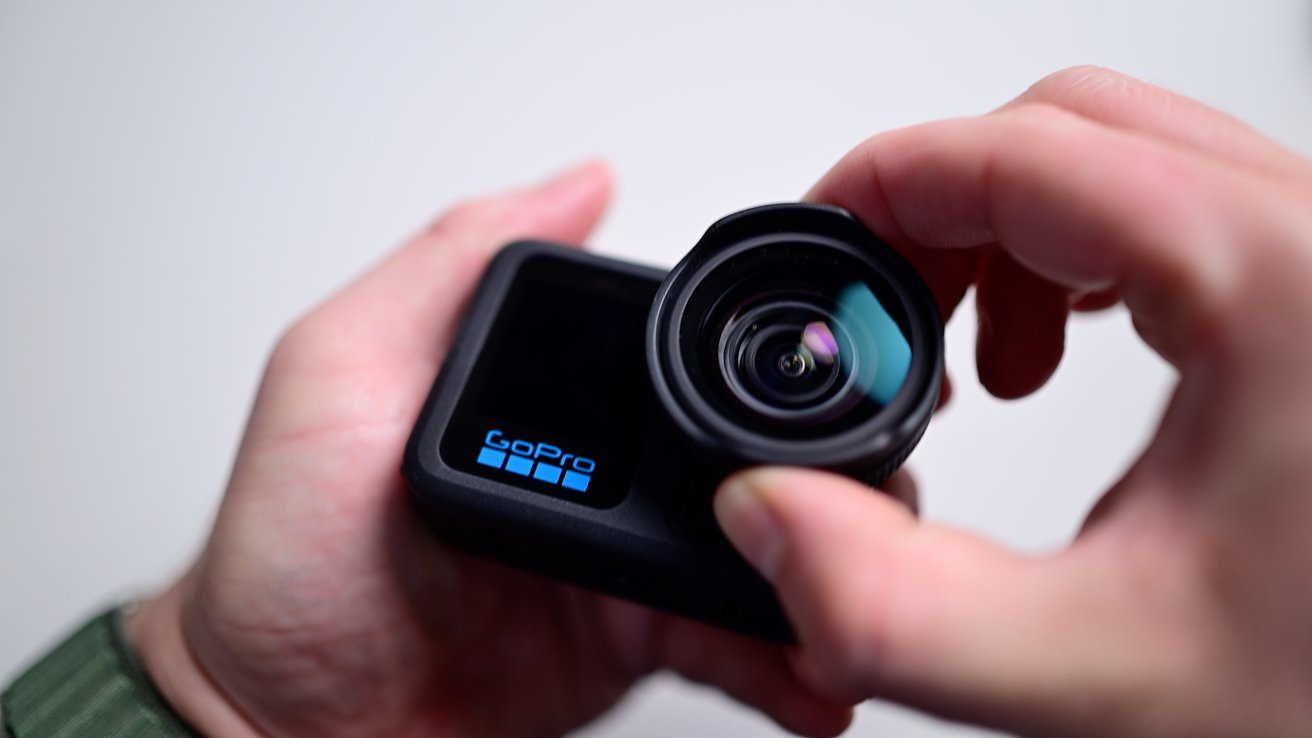 Attaching the macro lens to front of the GoPro Hero 13 Black