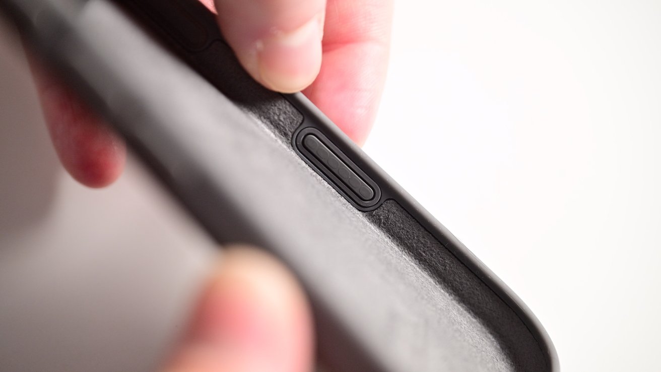 The inside of the case showing the conductive material on the underside of the camera control button