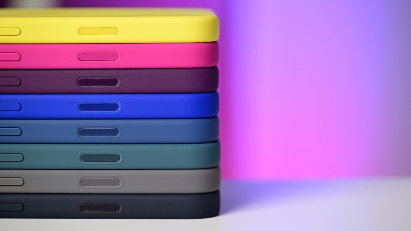 A stack of phone cases against a white and pink background