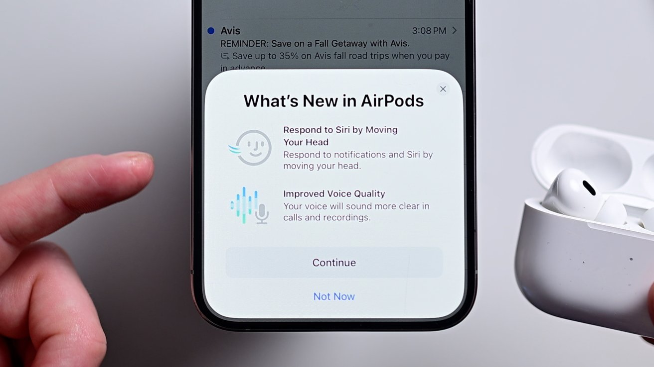 A modal on an iPhone screen informing users of the new head gestures and better audio quality