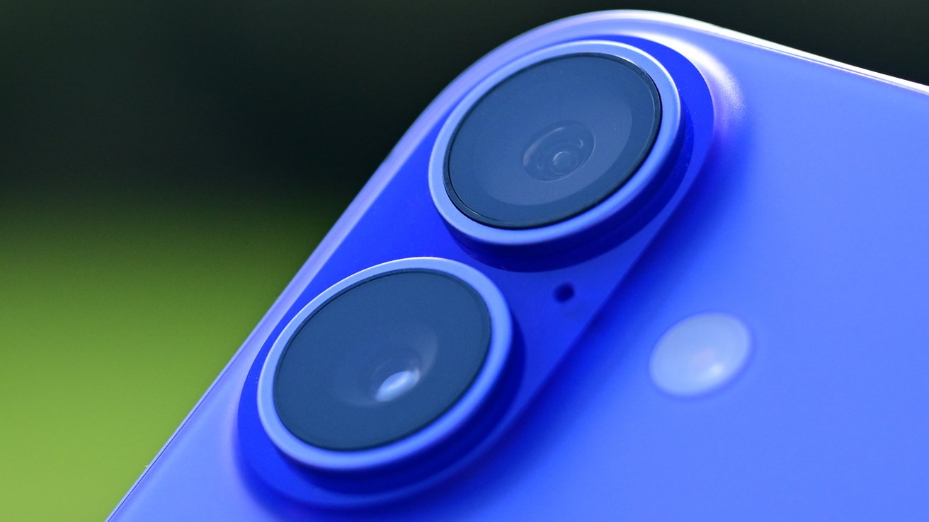 Close-up of the back of a blue smartphone featuring dual camera lenses and a small circular flash.