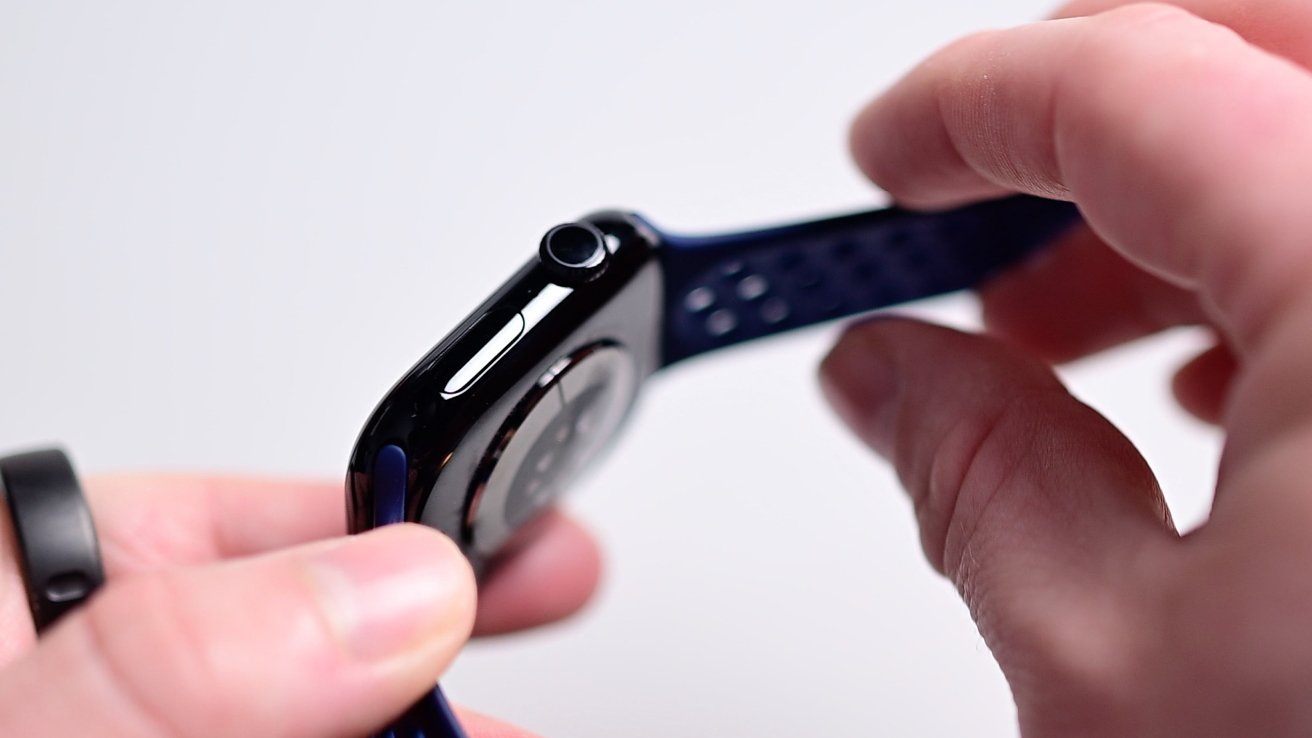 The new Jet Black aluminum Apple Watch held in hands