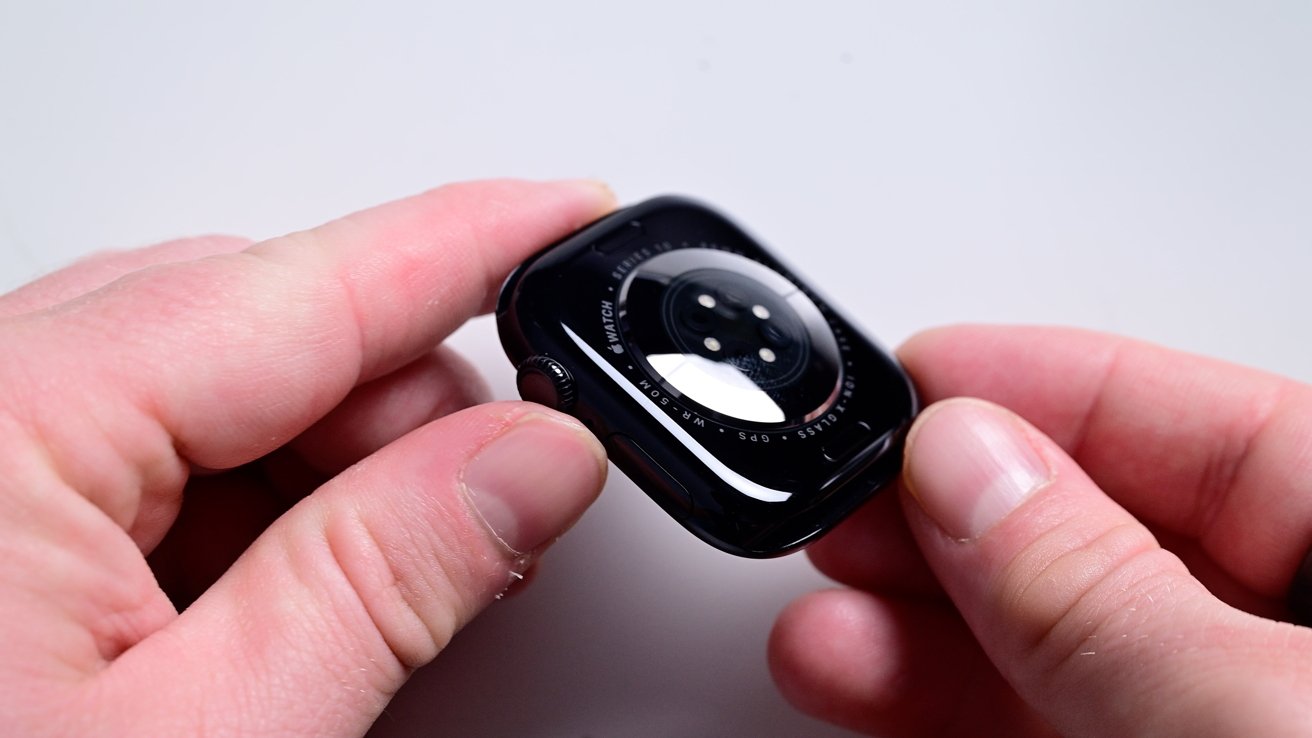 The back sensors of the new Apple Watch being held in a hand