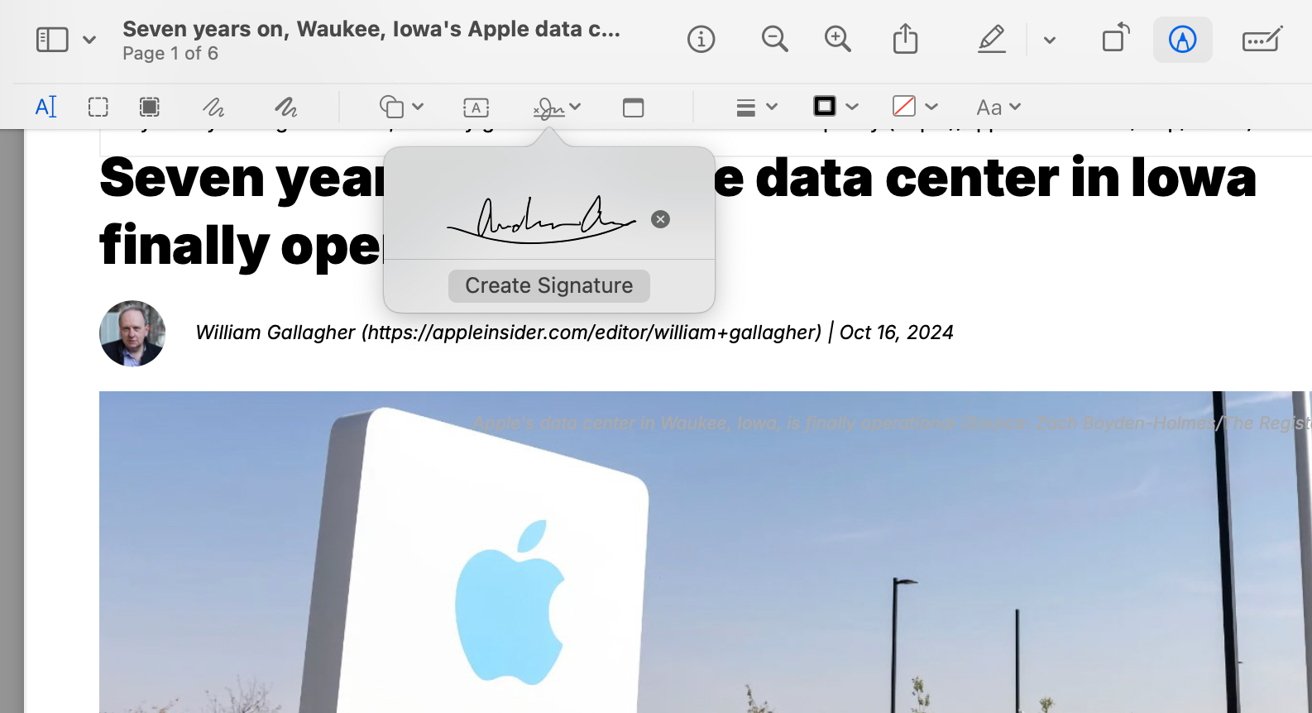 Article about Iowa's Apple data center opening, featuring a photo of a large Apple logo sign against a clear blue sky.