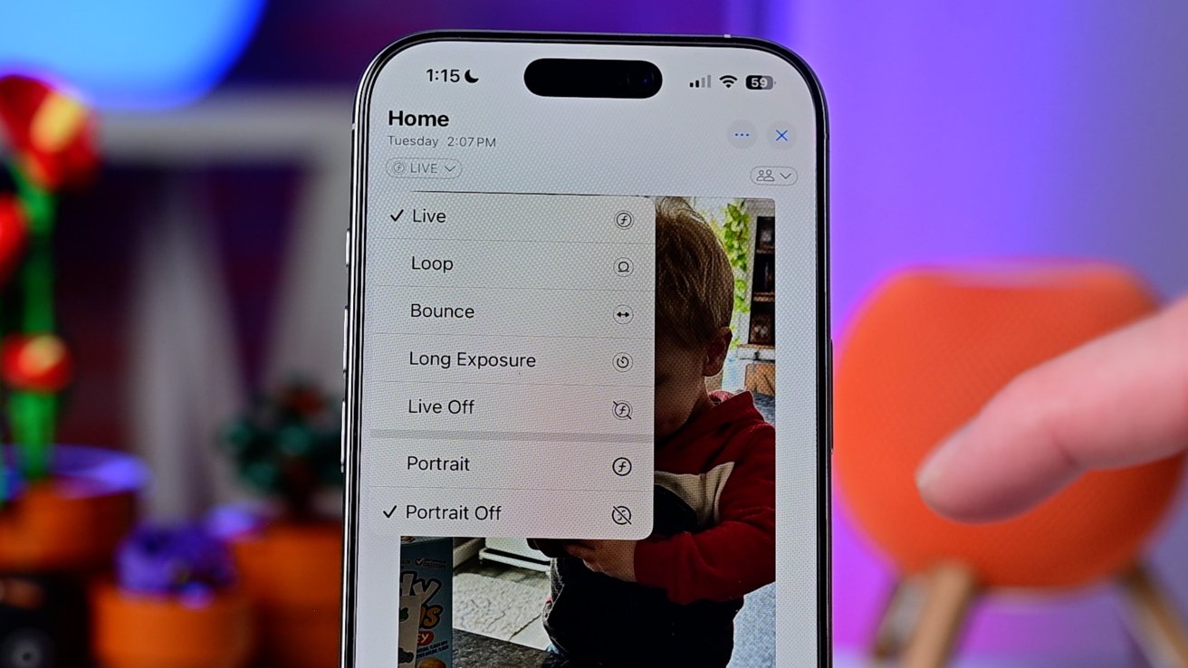 A smartphone screen displays a photo editing menu with options for Live, Loop, and Bounce effects, over a background of a child and colorful blurred objects.