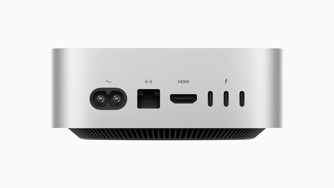 Silver device with multiple ports: power, Ethernet, HDMI, and three USB-C ports on the back panel.