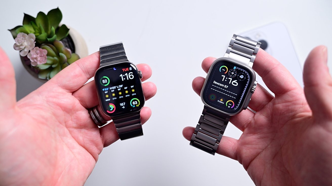 Two smartwatches with metal bands display digital faces, held in hands. A succulent plant and a phone are in the background.