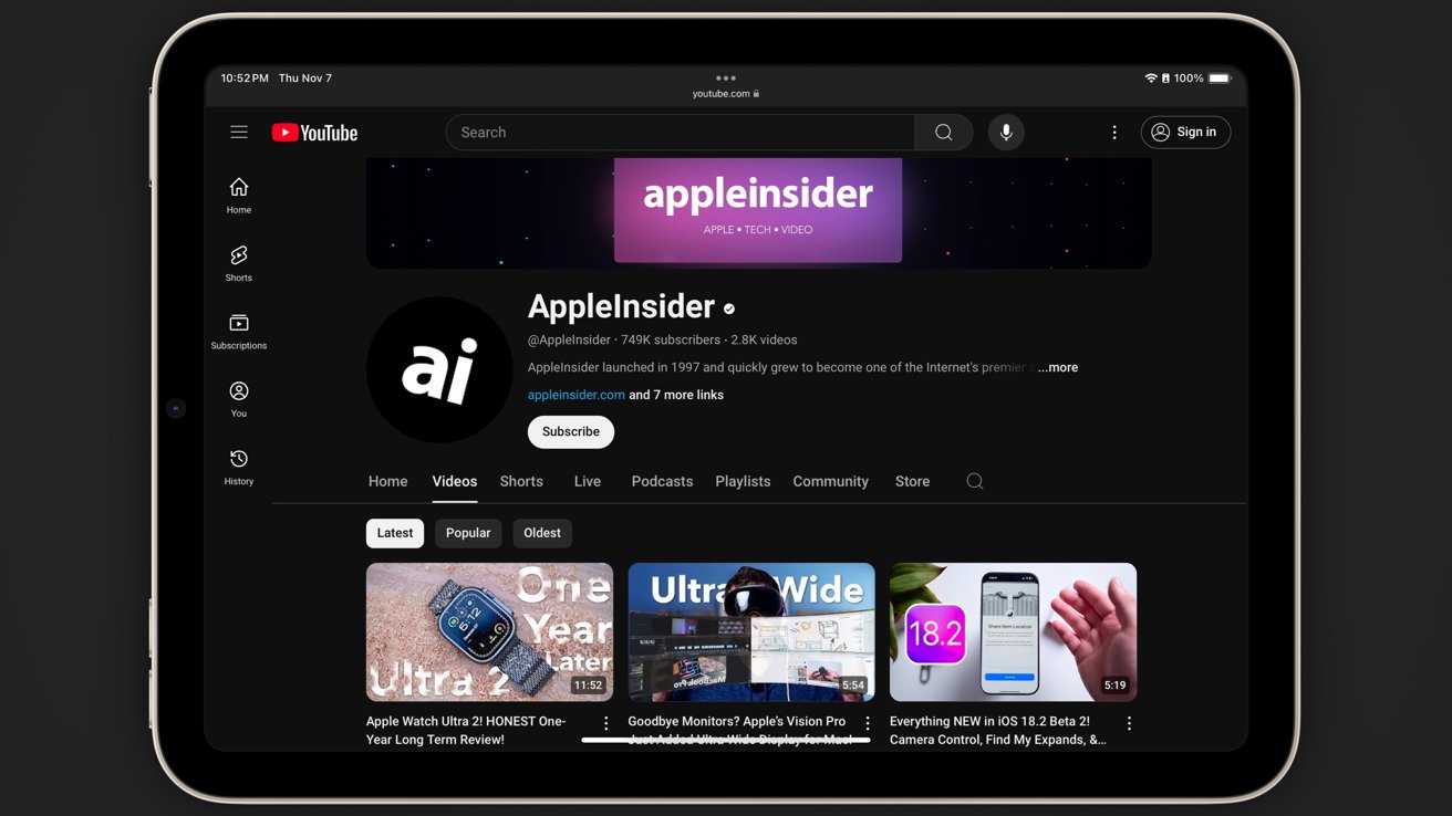 Tablet displaying a YouTube channel page with a dark theme. The channel is called 'AppleInsider' and features several video thumbnails below the banner.