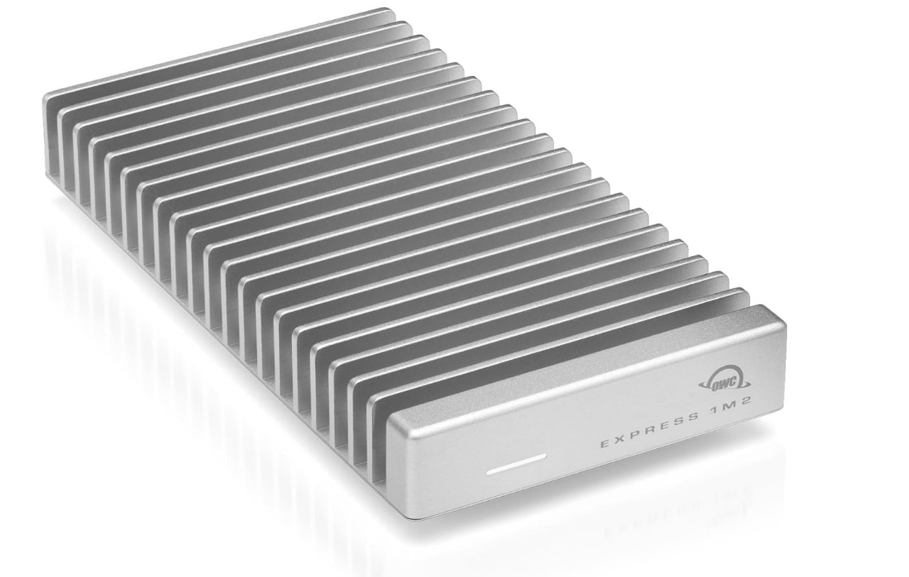 Silver, rectangular external hard drive with fins on top for heat dispersion, featuring a logo and text on the side panel.