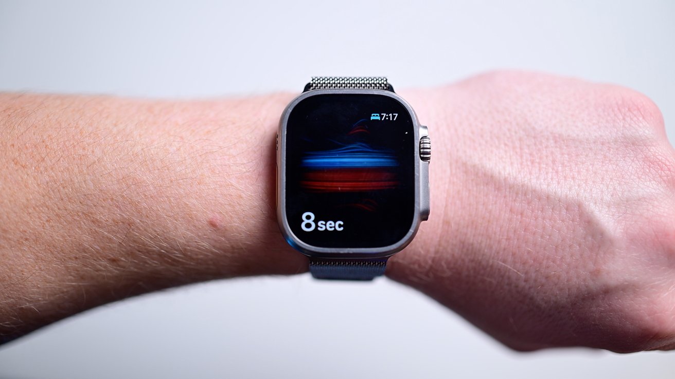 Smartwatch on a wrist displaying 7:17 time and 8 seconds countdown with abstract colorful design on the screen.