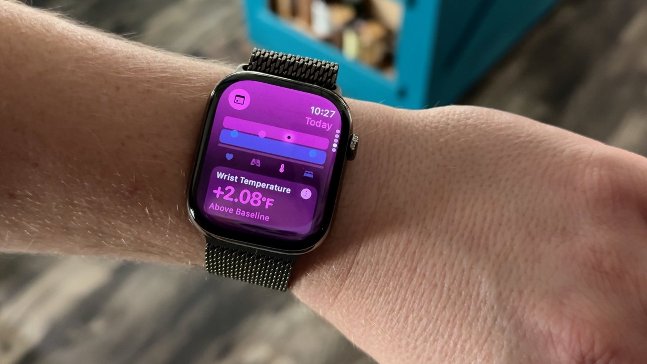 A smartwatch on a wrist displays wrist temperature as 2.08 degrees Fahrenheit above baseline with a purple interface.